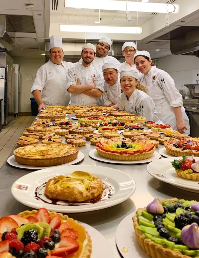 chef & students with their dishes
